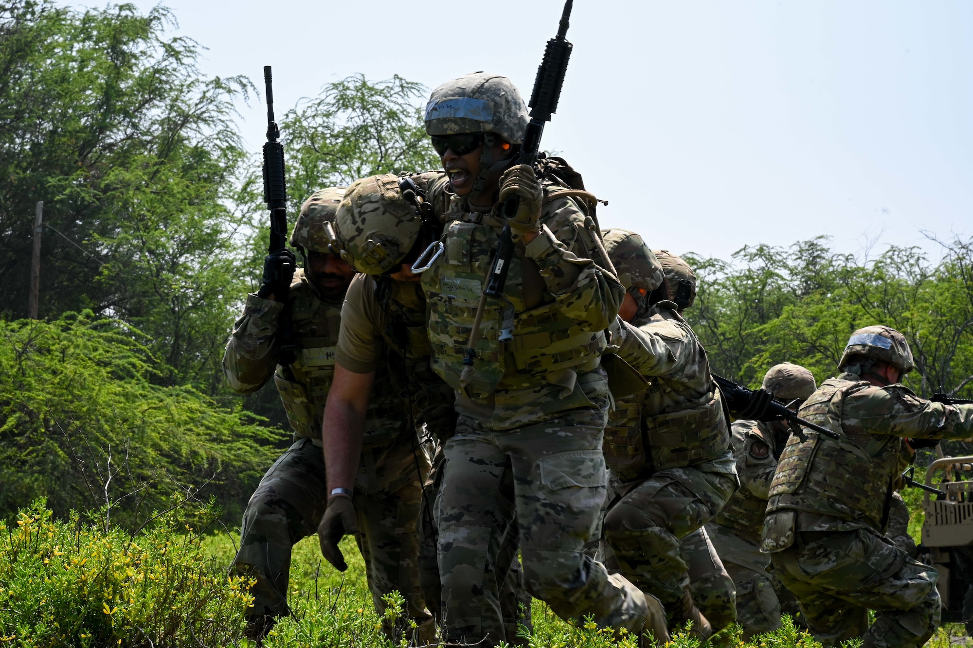 Senior NCOs egress to safety in an Agile Combat Employment field training exercise as part of the Pacific Paladin professional development course on Joint Base Pearl Harbor Hickam, Feb. 27, 2025.