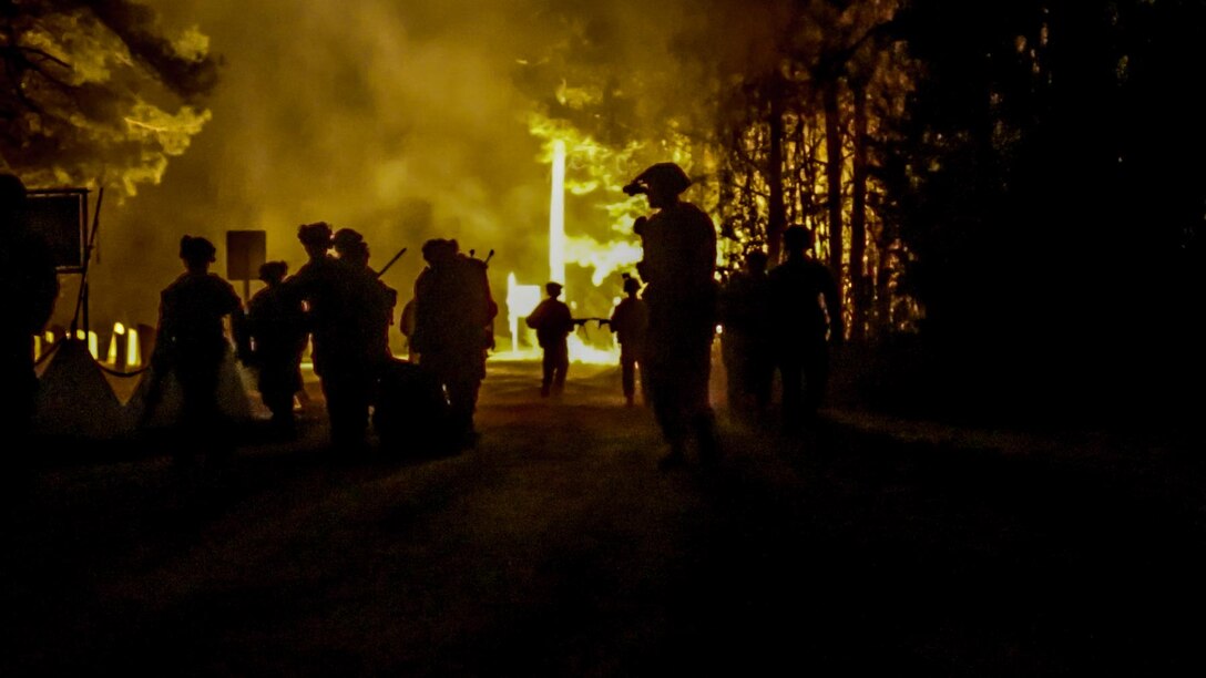 U.S. Marines with Lima Company, Battalion Landing Team 3rd Battalion, 6th Marine Regiment, 22nd Marine Expeditionary Unit, extract casualties in the course of a simulated night raid in support of Marine Air Ground Task Force (MAGTF) Interoperability Exercise at Stone Bay on Marine Corps Base Camp Lejeune, Feb. 8, 2025. The raid is one of several training events within the Marine Air Ground Task Force Interoperability, a course conducted by Expeditionary Operations Training Group. This course is designed to train and evaluate integrated elements of the 22nd MEU across a variety of full mission profiles in a simulated peer threat environment. (U.S. Marine Corps photo by Cpl. Emily Hazelbaker)