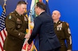 Pennsylvania Gov. Josh Shapiro passes the Pennsylvania National Guard flag to Maj. Gen. John Pippy during a ceremony Feb. 28, 2025, at Fort Indiantown Gap, Pa.. During the ceremony, Pippy was sworn in as Pennsylvania’s 55th adjutant general and promoted to his current rank. (Pennsylvania National Guard photo by Wayne V. Hall)