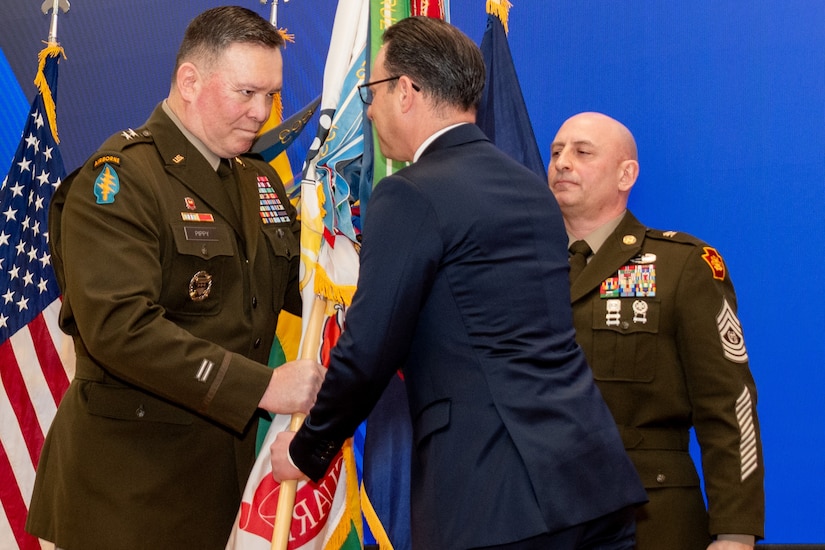 Pennsylvania Gov. Josh Shapiro passes the Pennsylvania National Guard flag to Maj. Gen. John Pippy during a ceremony Feb. 28, 2025, at Fort Indiantown Gap, Pa.. During the ceremony, Pippy was sworn in as Pennsylvania’s 55th adjutant general and promoted to his current rank. (Pennsylvania National Guard photo by Wayne V. Hall)
