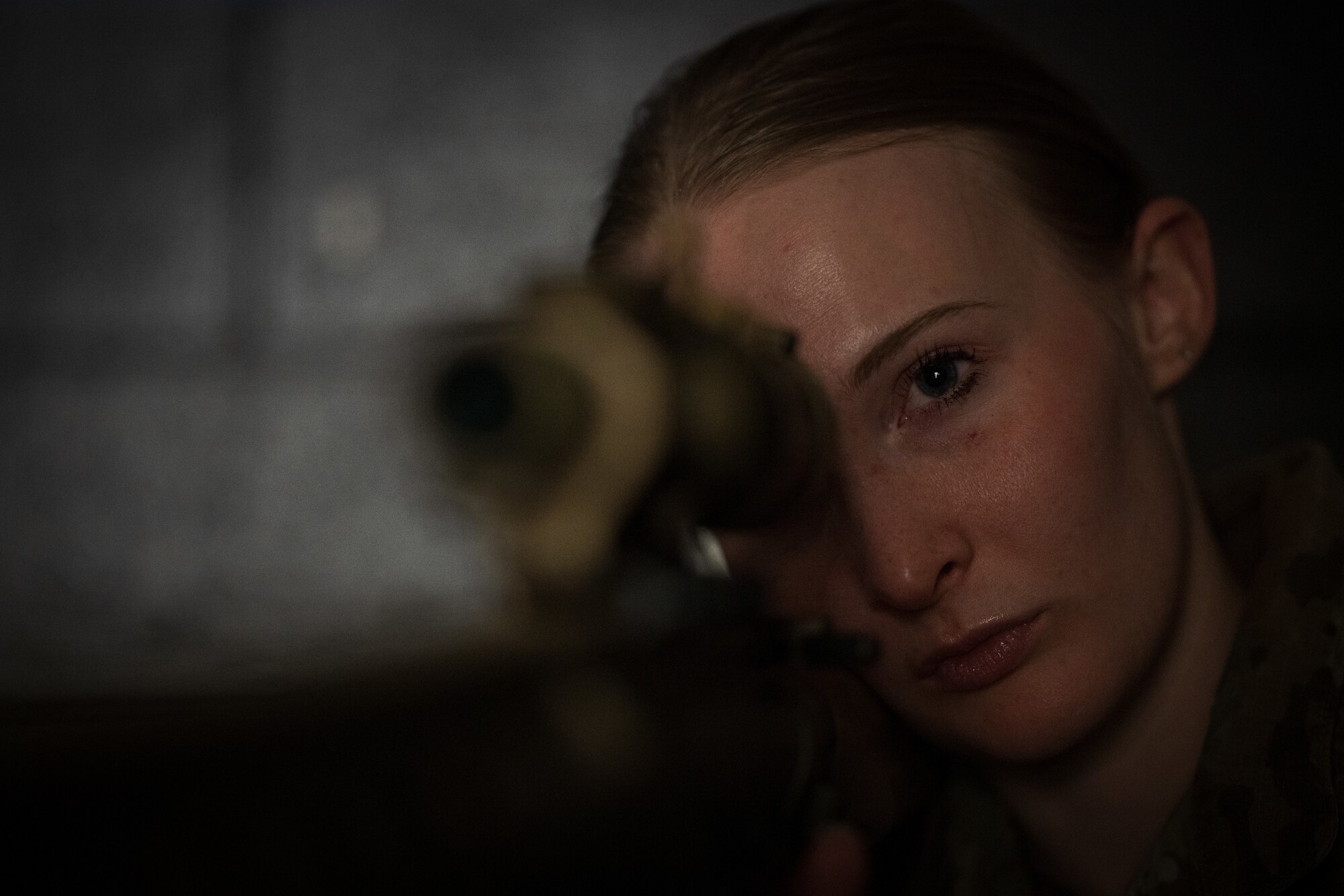 U.S. Air Force Senior Airman Samantha Karnes, 509th Security Forces Squadron defender, aims a M110A1 Squad Designated Marksman Rifle on Whiteman Air Force Base, Missouri, February 21, 2025. Karnes is one of two sniper qualified Airmen at Whiteman AFB. (U.S. Air Force photo by Tech. Sgt. Nicholas Alder)