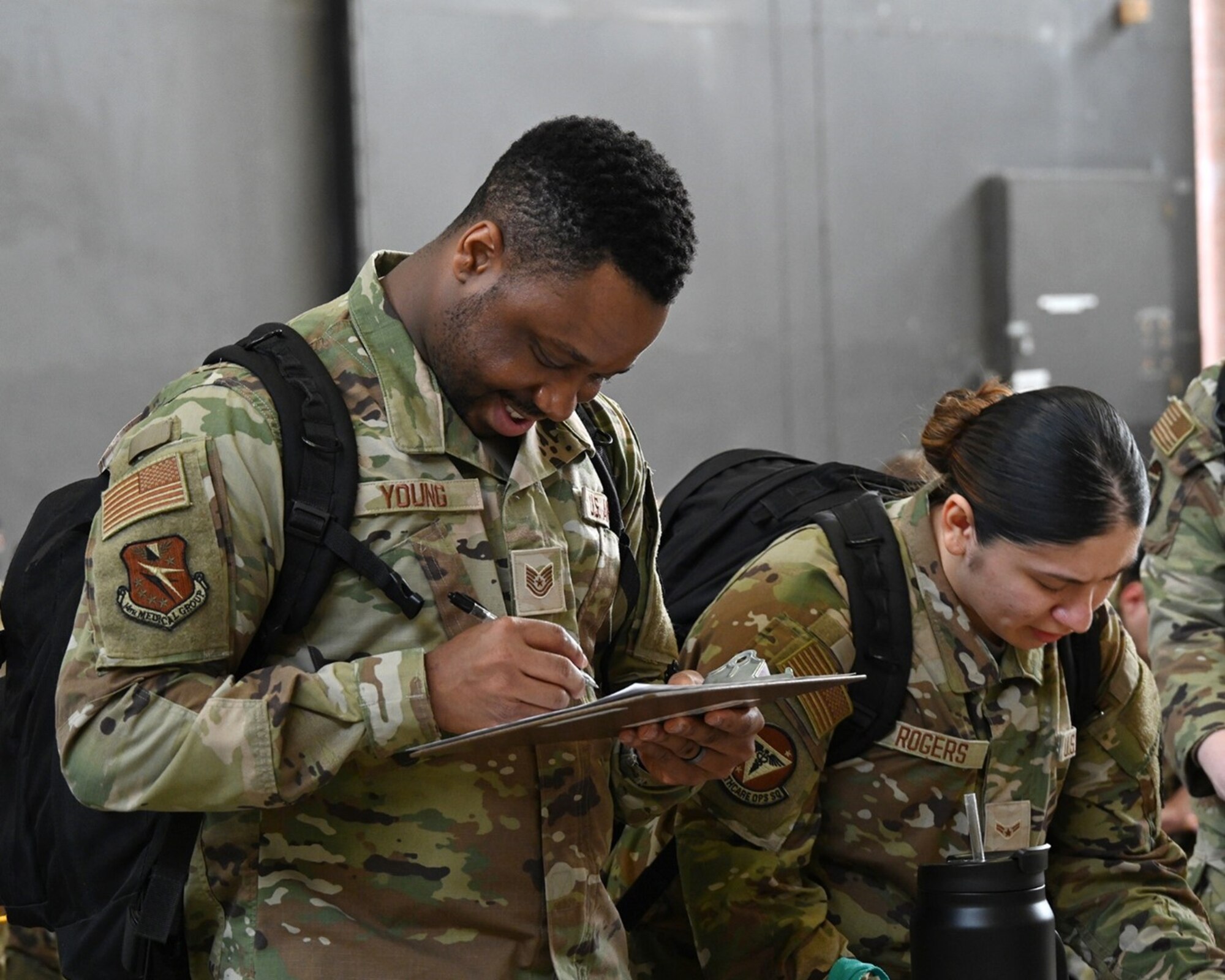 Deployers fill out paperwork for combat readiness exercise.