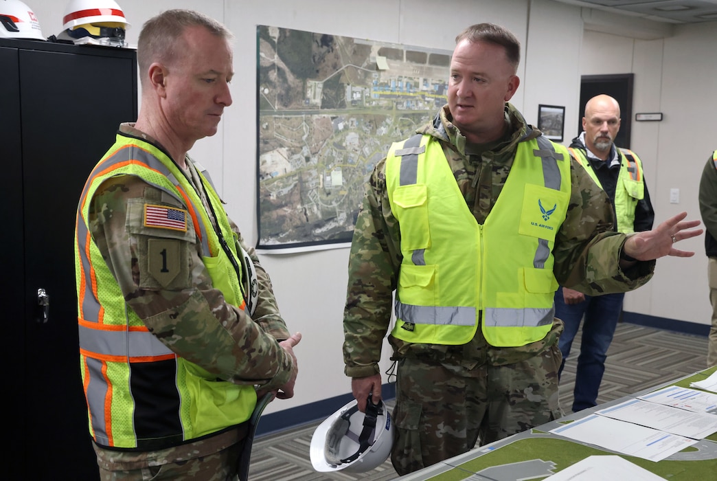 Brig. Gen. Kirk Gibbs, U.S. Army Corps of Engineers, Headquarters deputy chief of Military International Operations receives an update on Tyndall AFB