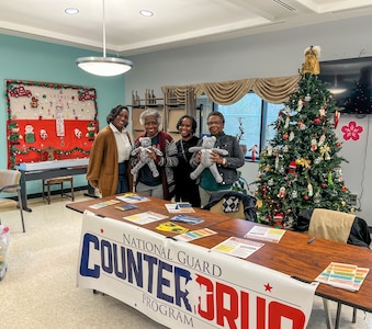 Members of the District of Columbia National Guard Drug Demand Reduction Outreach (DDRO) Civil Operators and the Metropolitan Police Department (MPD) coordinated with the Congress Heights Senior Wellness Center Dec. 16, 2024  in Washington D.C. to discuss prevention and wellness tips during the holiday season in Ward 8.