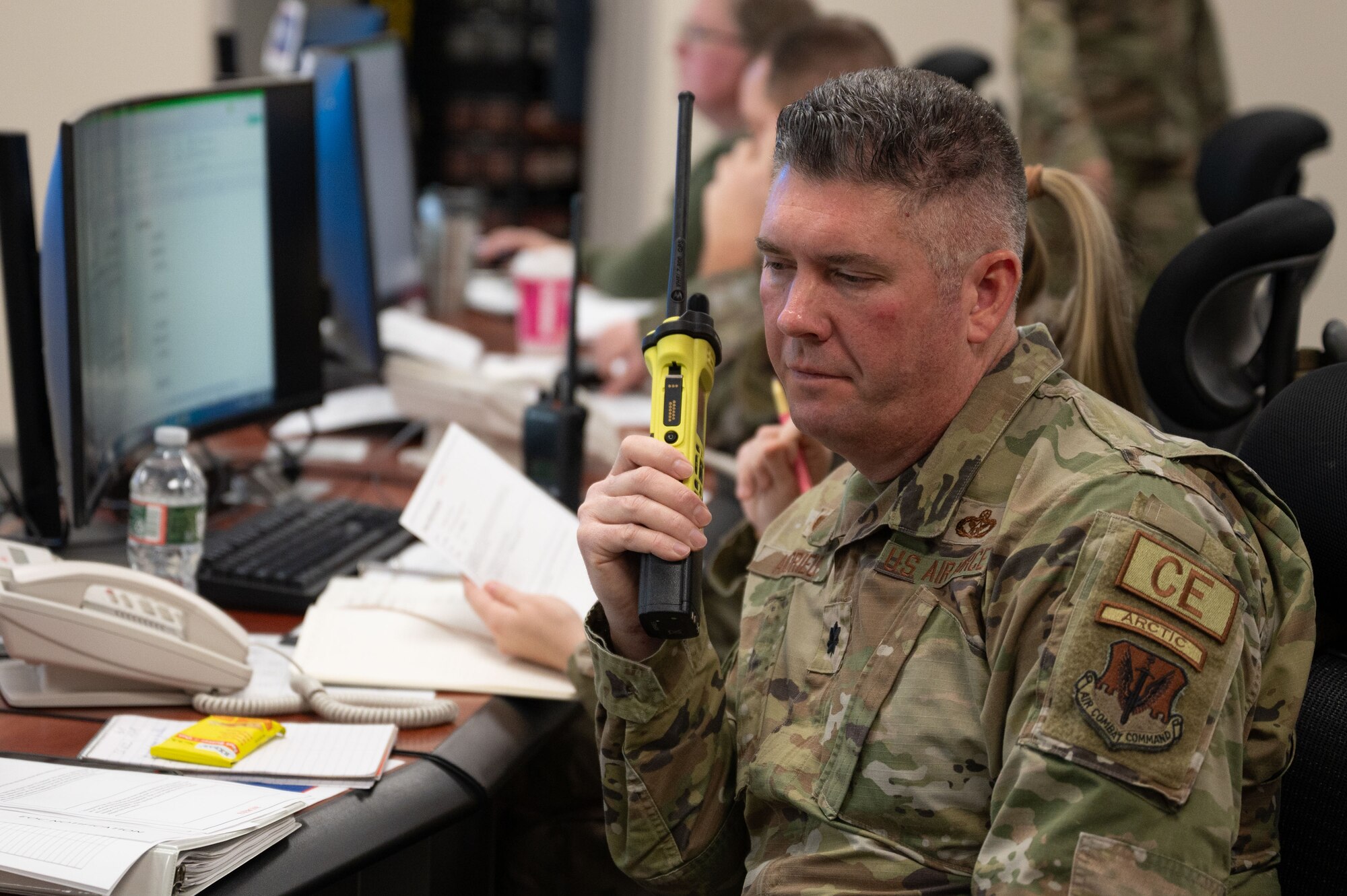 Airman speaks into radio.