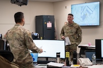 U.S. Air Force Lt. Col. Jeffery Andrieu, 102nd Civil Engineer Squadron commander, asks for updates from each member in the Emergency Operations Center during a natural disaster exercise on Otis Air National Guard Base, Massachusetts, Dec. 18, 2024.