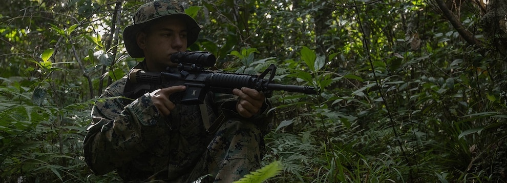 U.S. Marine Corps Lance Cpl. Ethan Miller, an aviation meteorological equipment technician with 3d Intelligence Battalion, III Marine Expeditionary Force Information Group, provides security during Talent Aries 25.1 at Jungle Warfare Training Center, Camp Gonsalves, Okinawa, Japan, Dec. 10, 2024.