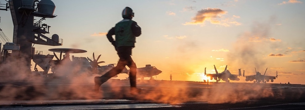 Sailors run across the flight deck during flight operations aboard the Nimitz-class aircraft carrier USS Carl Vinson (CVN 70), Dec. 11, 2024.