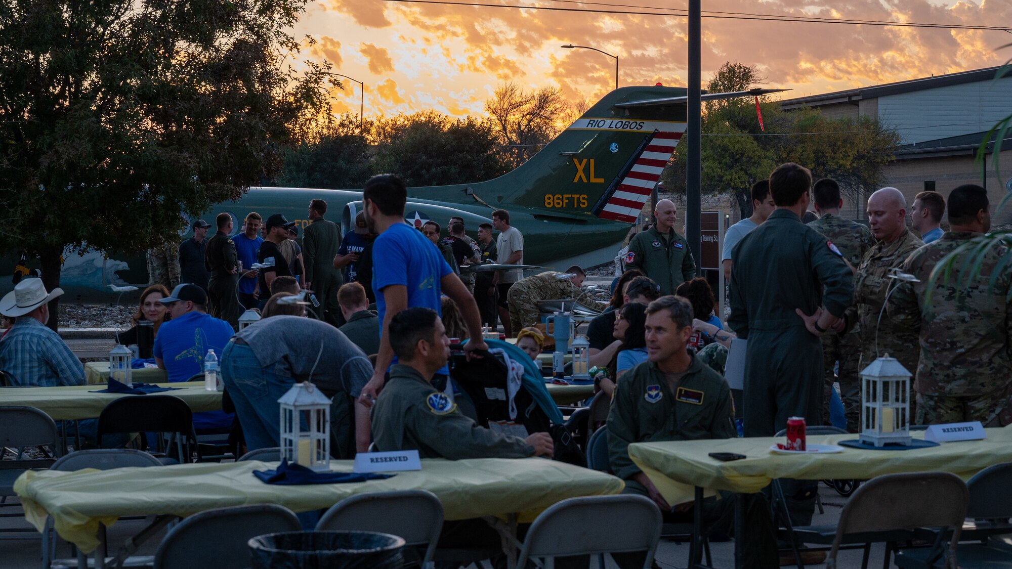 Airmen come together to celebrate the legacy of the T-1A Jayhawk at Laughlin Air Force Base, Texas, Dec. 16, 2024. Airmen of the 86th Flying Training Squadron held a barbecue and ceremony to celebrate the 31 years of service the T-1A had at Laughlin. (U.S. Air Force photo by Staff Sgt. Nicholas Larsen)
