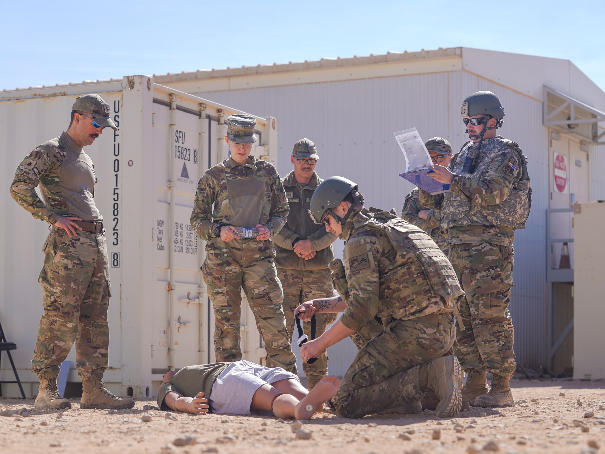 Airmen assigned to the 378th Air Expeditionary Wing practice first aid during a post-attack reconnaissance rodeo, Dec. 13, 2024, in the U.S. Central Command area of responsibility.