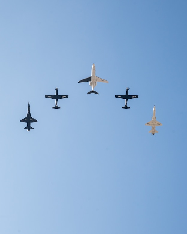 A five-ship formation flies together at Laughlin Air Force Base, Texas, Dec. 17, 2024. The final flight of the T-1A at Laughlin consisted of two T-6A Texan IIs, two T-38C Talons, and the final T-1A Jayhawk. (U.S. Air Force photo by Staff Sgt. Nicholas Larsen)