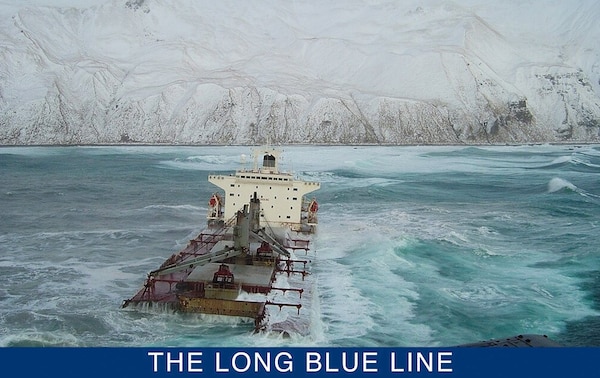 The aft section of the wreck of the Selendang Ayu photographed against the backdrop of Unalaska Island. (NOAA)