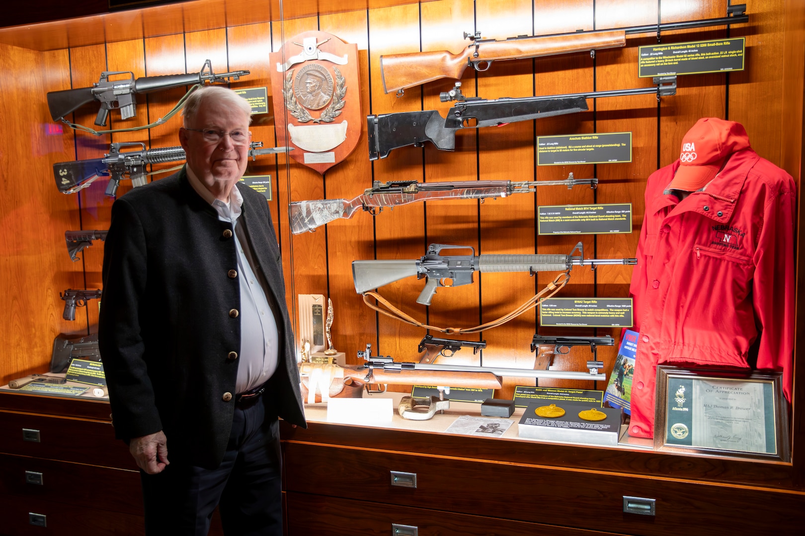 Gary Anderson, former Nebraska Guardsman, donates his 1964 Olympic gold medal winning rifle to the Nebraska National Guard Museum in Seward, Nebraska, Dec. 27, 2024. Anderson used the rifle to lead the U.S.A. marksmanship team to two 300-meter World Championship Gold Medals. He also used it to win a gold medal in the 1963 Pan American Games in the 300-Meter (3x40) free rifle event with a score of 1,146, just one point shy of the world record at the time.

It was the same rifle that Anderson used to win a Gold Medal at the 1964 Olympics in Tokyo on Oct. 15, 1964., the first of two consecutive Olympic Golds the Axtell, Nebraska, native earned in the 1960s while also serving as a Nebraska Army Guard engineering officer In Hastings and Grand Island.

(U.S. Army photo by Staff Sgt. Gauret Stearns)