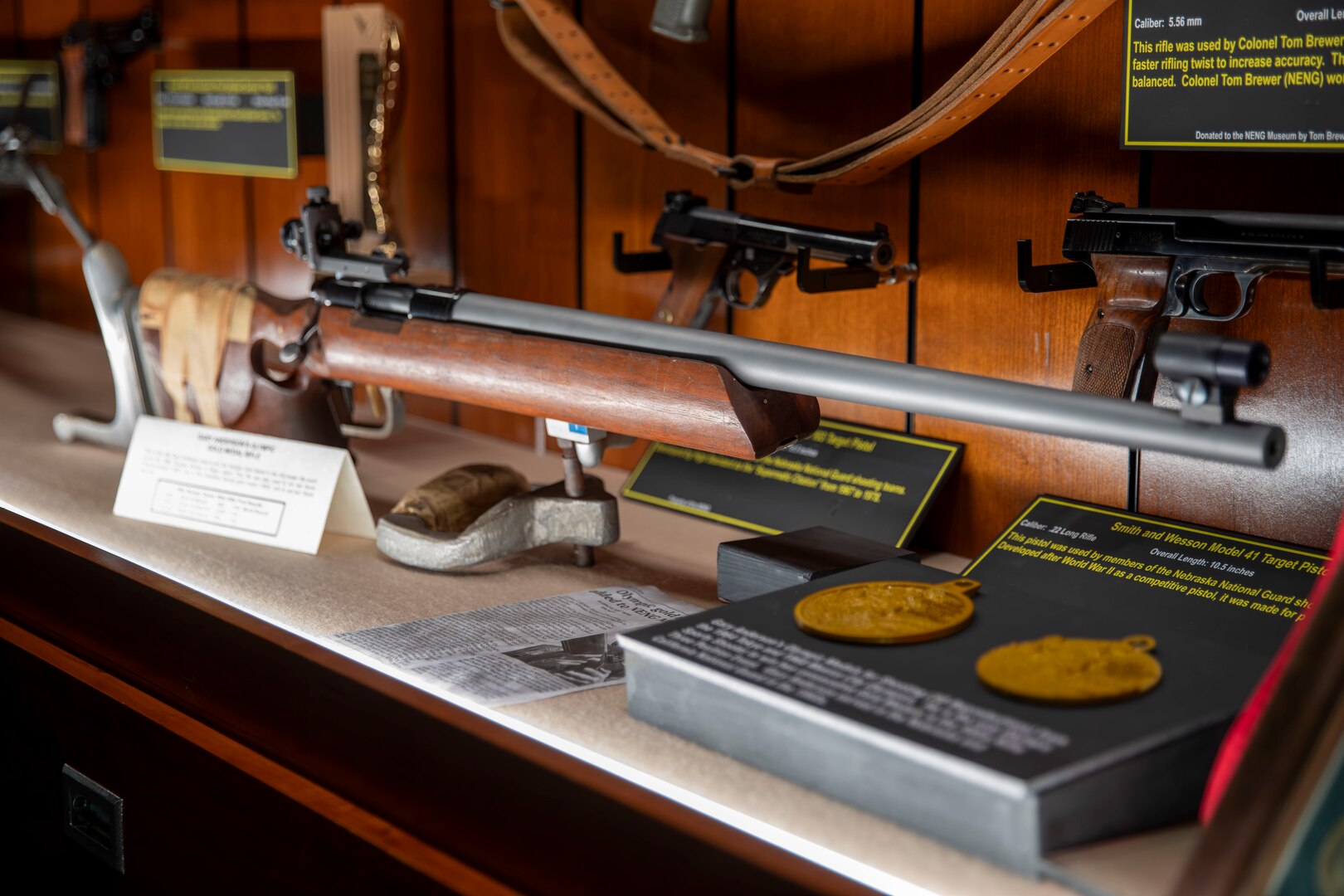 Gary Anderson, former Nebraska Guardsman, donates his 1964 Olympic gold medal winning rifle to the Nebraska National Guard Museum in Seward, Nebraska, Dec. 27, 2024. Anderson used the rifle to lead the U.S.A. marksmanship team to two 300-meter World Championship Gold Medals. He also used it to win a gold medal in the 1963 Pan American Games in the 300-Meter (3x40) free rifle event with a score of 1,146, just one point shy of the world record at the time.

It was the same rifle that Anderson used to win a Gold Medal at the 1964 Olympics in Tokyo on Oct. 15, 1964., the first of two consecutive Olympic Golds the Axtell, Nebraska, native earned in the 1960s while also serving as a Nebraska Army Guard engineering officer In Hastings and Grand Island.

(U.S. Army photo by Staff Sgt. Gauret Stearns)