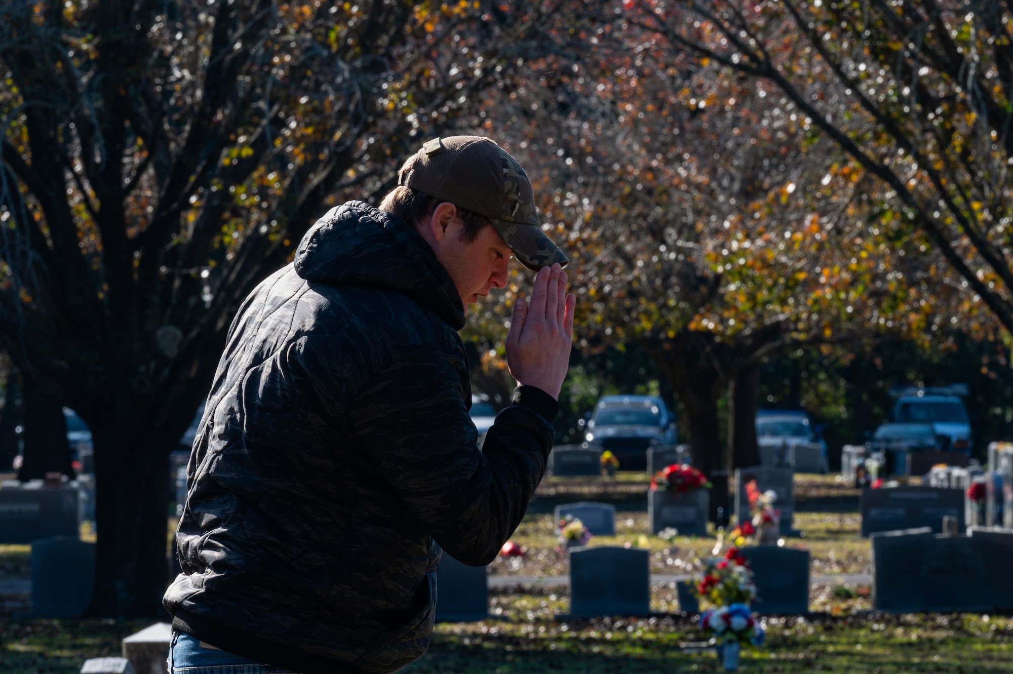 A member of the local community renders a salute to a fallen veteran during the Wreaths Across America Placement Ceremony at Beal Memorial Cemetery, Florida, Dec. 14, 2024.