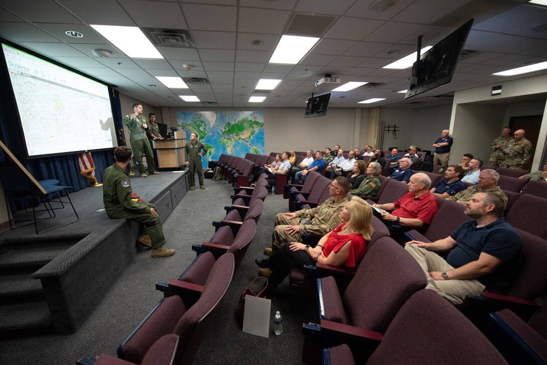 Aircrew members from the 165th Airlift Squadron provide a pre-flight briefing to a group of civilian employers before an orientation flight on a C-130J Super Hercules aircraft at the Kentucky Air National Guard base in Louisville, Ky., Sept. 19, 2024.