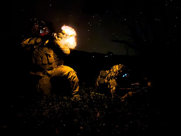 U.S. Army Reserve Soldiers from the 100th Battalion, 442nd Infantry Regiment, 322nd Civil Affairs Brigade, 9th Mission Support Command return fire while defending a forward operating base during the Joint Pacific Multinational Readiness Center (JPMRC) 25-01 at Pohakuloa Training Area, Hawaii, Oct. 11, 2024.