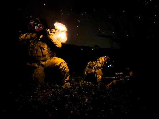 U.S. Army Reserve Soldiers from the 100th Battalion, 442nd Infantry Regiment, 322nd Civil Affairs Brigade, 9th Mission Support Command return fire while defending a forward operating base during the Joint Pacific Multinational Readiness Center (JPMRC) 25-01 at Pohakuloa Training Area, Hawaii, Oct. 11, 2024.