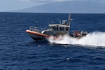 Coast Guard Station Maui’s 45-foot Response Boat-Medium crew conduct search patterns by water during a search and rescue exercise (SAREX) near Kapalua, Maui, Oct. 24, 2019. The training brought a wide range of services together including the Coast Guard, Maui County Fire Department, Ocean Safety and Lifeguard Services, American Medical Response, and Maui County Police Department. (U.S. Coast Guard photo by Petty Officer 2nd Class Jim Connor/Released)