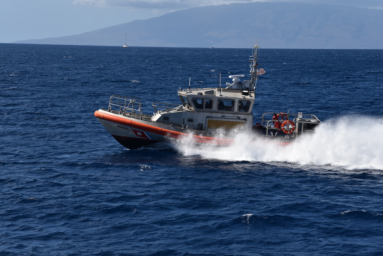 Coast Guard Station Maui’s 45-foot Response Boat-Medium crew conduct search patterns by water during a search and rescue exercise (SAREX) near Kapalua, Maui, Oct. 24, 2019. The training brought a wide range of services together including the Coast Guard, Maui County Fire Department, Ocean Safety and Lifeguard Services, American Medical Response, and Maui County Police Department. (U.S. Coast Guard photo by Petty Officer 2nd Class Jim Connor/Released)