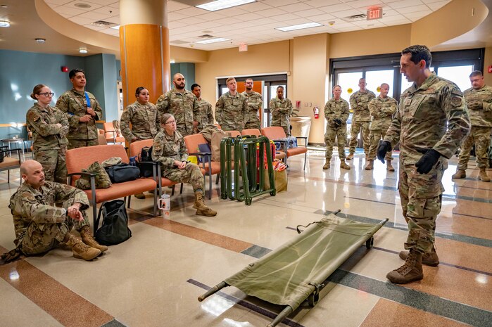 For an emergency medical support request in response to the New Year’s Eve fireworks explosion in Hawaii, Reserve Citizen Airmen from the 944th Fighter Wing’s 944th Aeromedical Staging Squadron (ASTS) receive a briefing on patient movement techniques at the 56th Medical Group clinic at Luke Air Force Base, Ariz., Jan. 4, 2025. The briefing prepared the team for a joint operation to support critically injured patients from Hawaii, showcasing the unit’s readiness for real-world missions. The 944th ASTS, a unit known for its expertise in aeromedical evacuation, provided critical manpower for offloading the patients from the aircraft and transferring them to ambulances at the Phoenix Sky Harbor Airport. “Helping people who can’t help themselves – that’s why I joined,” explained Staff Sgt. Nathan Espinoza, 944th ASTS. “Seeing the resilience of these patients and knowing that our efforts are making a difference is incredibly rewarding.” (U.S. Air Force photo by Staff Sgt. Alexis Orozco)