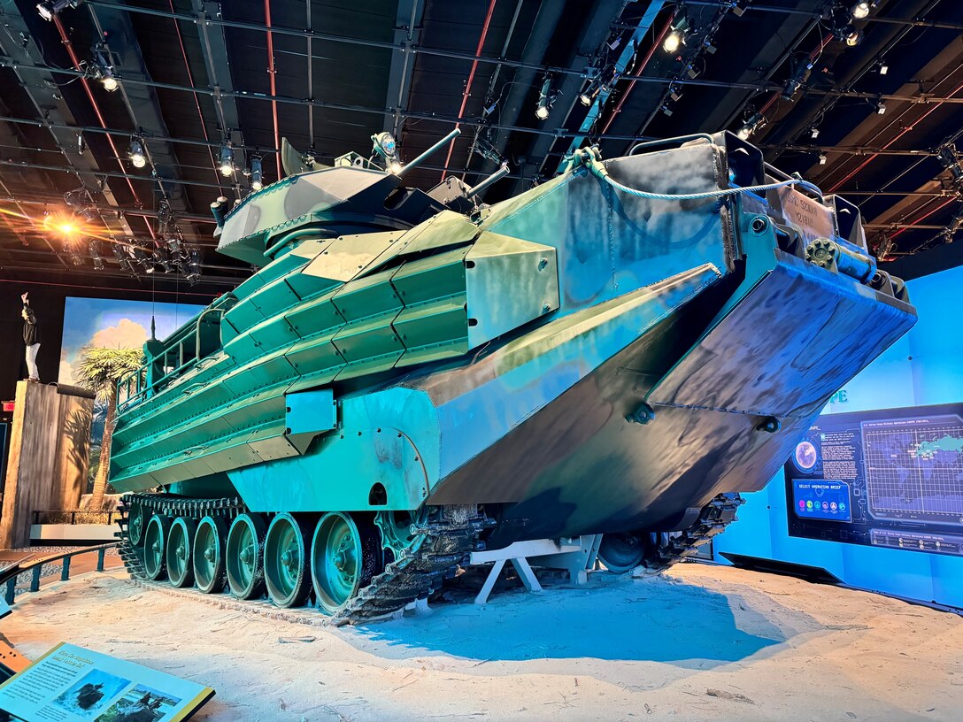 An Amphibious Assault Vehicle (AAV) takes center stage, embodying the Marine Corps' legacy of amphibious warfare and adaptability. Featured in the National Museum of the Marine Corps, this display honors the vehicle's pivotal role in projecting power from sea to shore