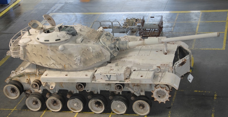 Genesis II, an M60A1 Main Battle Tank, sits in the craneway of Marine Depot Maintenance Command waiting to be refurbished as part of a restoration project between MDMC and the National Museum of the Marine Corps in 2015.