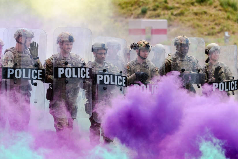 Members of the Kentucky Air National Guard’s 123rd Security Forces Squadron demonstrate riot-control techniques at Camp San Luis Obispo, Calif., May 16, 2024, as part of an information exchange between 27 Kentucky Guard Airmen and six Ecuadorian special forces Airmen.