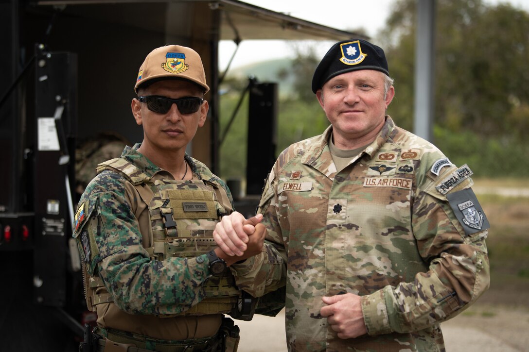 Lt. Col. Joshua Elwell, right, commander of the Kentucky Air National Guard’s 123rd Security Forces Squadron, greets his counterpart from the Ecuadorian Air Force Special Operations Command during an information exchange event at Camp San Luis Obispo, Calif., May 17, 2024.