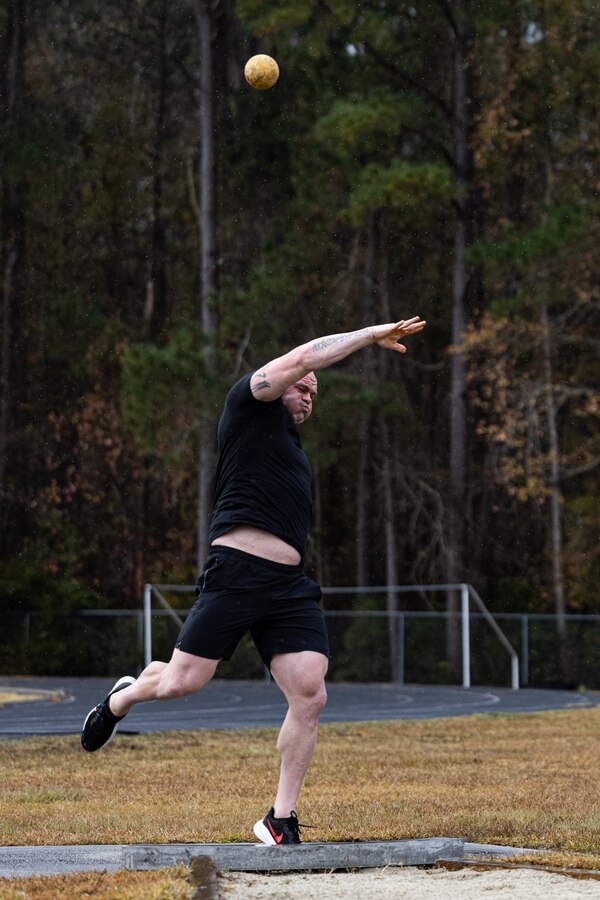 U.S. Marine Corps Gunnery Sgt. Zakery Noland, a recovering service member with Wounded Warrior Battalion-East (WWBn-E), participates in the shot put event during the WWBn-E Mini-Trials on Marine Corps Base Camp Lejeune, North Carolina, Dec. 9, 2024. The WWBn-E Mini-Trials foster recovery and rehabilitation by encouraging adaptive sport participation, while also building camaraderie among recovering service members. This event provides an opportunity for participants to refine their skills and demonstrate their progress in a supportive yet competitive environment. (U.S. Marine Corps photo by Cpl. Loriann Dauscher)