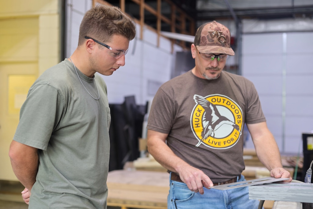 Calvin Martin gets instructions from Zachary Smith, program manager of ERDC’s R&D Fabrication Group, while working at the R&D Shop