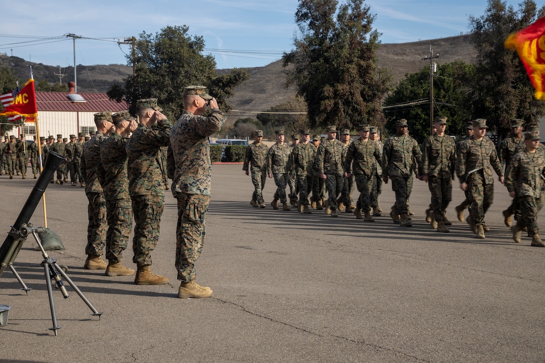 U.S. Marine leaders with 11th Marine Regiment, 1st Marine Division, salute as the Marines of Fire Support Battalion, 11th Marines, pass in review during the battalion’s activation ceremony at Marine Corps Base Camp Pendleton, California, Dec. 19, 2024. The activation of the battalion, which is the first of its kind, is a major step in providing ground commanders with the fire support capabilities to plan, coordinate, and synchronize fires to accomplish missions. (U.S. Marine Corps photo by Sgt. Adeola Adetimehin)