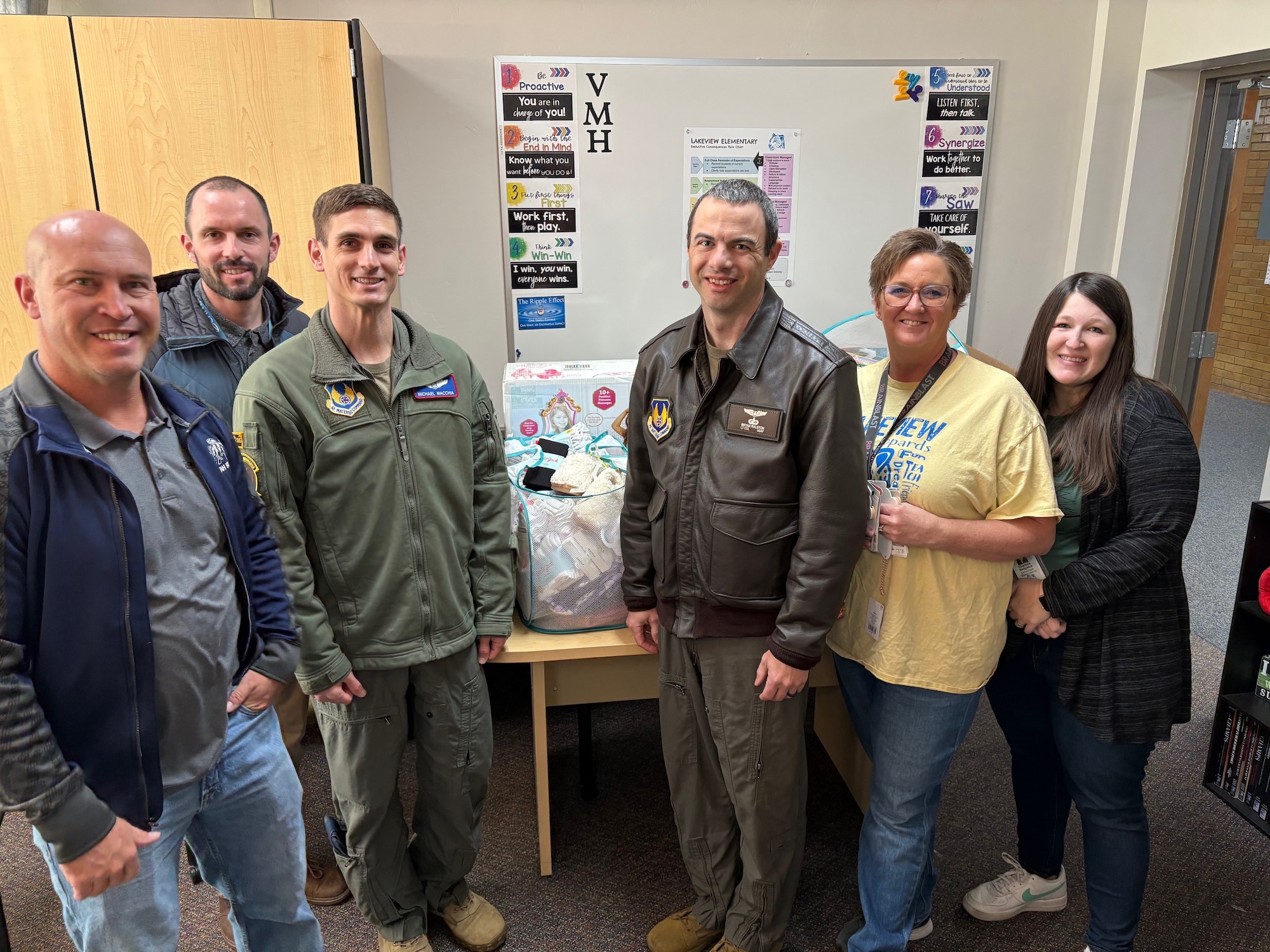 To ring in the holidays and spread some Christmas spirit, team members from the Arnold Engineering Development Complex 719th Test Squadron at Hill Air Force Base, Utah, collected and delivered Christmas presents to five children from three families in the local community Dec. 6, 2024. The gifts, along with gift cards for Christmas dinner, were delivered to Lakeview Elementary in Roy, Utah. The members of the 719 TS are comprised of military, Department of Defense government personnel and contract personnel supporting the Sentinel program at Hill AFB. They report at group level to the AEDC 804th Test Squadron at Arnold Air Force Base, Tenn., headquarters of AEDC. Contract personnel with the 719 TS are hired by and work for Canvas, Inc., which provided the gift cards for the Christmas dinner. Pictured from left are Trevor Foust, Technical Management and Advisory Services group lead; Gus Marshall, group deputy; Maj. Mike Macchia, director of Intercontinental Ballistic Missile Flight Test; Lt. Col. Bryan Ralston, 719 TS commander; and two members of the Lakeview Elementary School staff. (Courtesy photo)