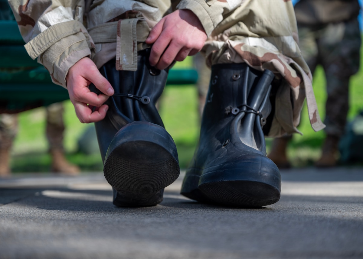 Mission-Oriented Protective Posture gear is doned during chemical, biological, radiological, and nuclear response training during a deployment readiness exercise, Presidio of Monterey, Calif., Jan. 6, 2025. MOPP gear is designed to shield service members from harmful agents that could cause severe injury or death. (U.S. Air Force photo by Senior Airman Sarah Williams)