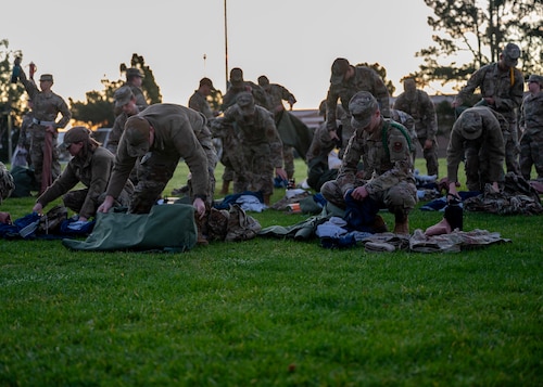 Airmen line up for a bag drop during a deployment readiness exercise, Presidio of Monterey, Calif., Jan. 6, 2025. The bag drag ensured that all required equipment was packed and ready in the event of a deployment. (U.S. Air Force photo by Senior Airman Sarah Williams)