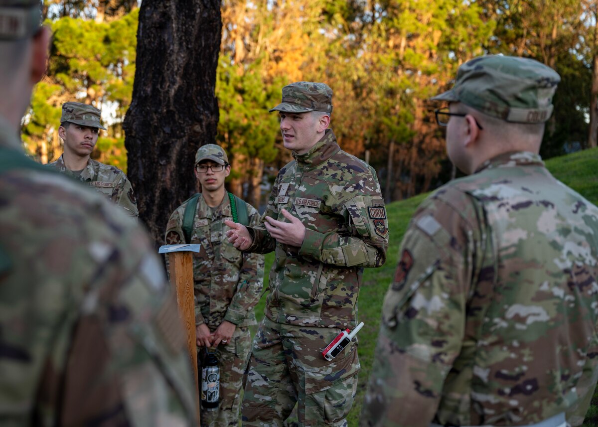 U.S. Air Force Airman Steven Barron, 60th Civil Engineer Squadron emergency management, demonstrates how to use M8 tape during chemical, biological, radiological, and nuclear response training during a deployment readiness exercise, Presidio of Monterey, Calif., Jan. 6, 2024. M8 tape helps identify the threat of dangerous chemical agents, providing critical life-saving information to personnel. (U.S. Air Force photo by Senior Airman Sarah Williams)