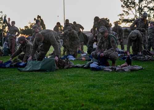 Airmen line up for a bag drop during a deployment readiness exercise, Presidio of Monterey, Calif., Jan. 6, 2025. The bag drag ensured that all required equipment was packed and ready in the event of a deployment. (U.S. Air Force photo by Senior Airman Sarah Williams)