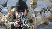 U.S. Army Sgt. 1st Class Rani Doucette, an instructor with the Pennsylvania National Guard's Individual Training Branch, instructs Soldiers on how to fire an M249 light machine gun during the Individual Weapons Course at Fort Indiantown Gap, Pennsylvania, April 4, 2024. (U.S. Army National Guard photo by 2nd Lt. Kate Kramer)