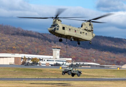 U.S. Soldiers and Airmen with the Pennsylvania National Guard engage with members of the local community during an open house at Fort Indiantown Gap, Pennsylvania, Nov. 16, 2024. This free event featured Miss Pennsylvania, live tactical demonstrations, flyovers, displays of military equipment and vehicles, food trucks, live music and a performance by the Pennsylvania National Guard’s Ambassador Demonstration Team. (U.S. Army National Guard photo by Wayne V. Hall)