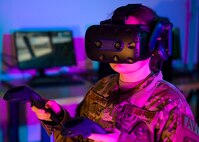 A 193rd Special Operation Wing airman uses virtual reality (VR) maintenance MC-130J Commando II training system in Middletown, Pennsylvania, Feb. 7 2024. VR is expected to provide more efficient and timely maintenance training, resulting in cost savings and increased aircraft availability. (U.S. Air National Guard photo by Staff Sgt. Bela John Vaszlavik)