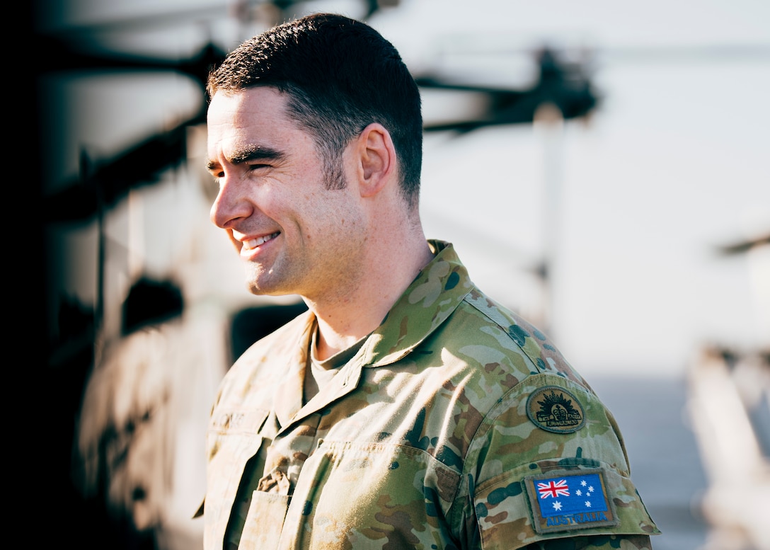 Australian Army Maj. Jack Jones, the assistant logistics officer of the 15th Marine Expeditionary Unit, speaks to U.S. Marines assigned to the 15th MEU aboard the amphibious assault ship USS Boxer (LHD 4) while underway in the Pacific Ocean Nov. 21, 2024. Jones recently deployed with the 15th MEU to the Indo-Pacific region as part of the Marine Corps Personnel Exchange Program. (U.S. Marine Corps photo by Gunnery Sgt. Donald Holbert)