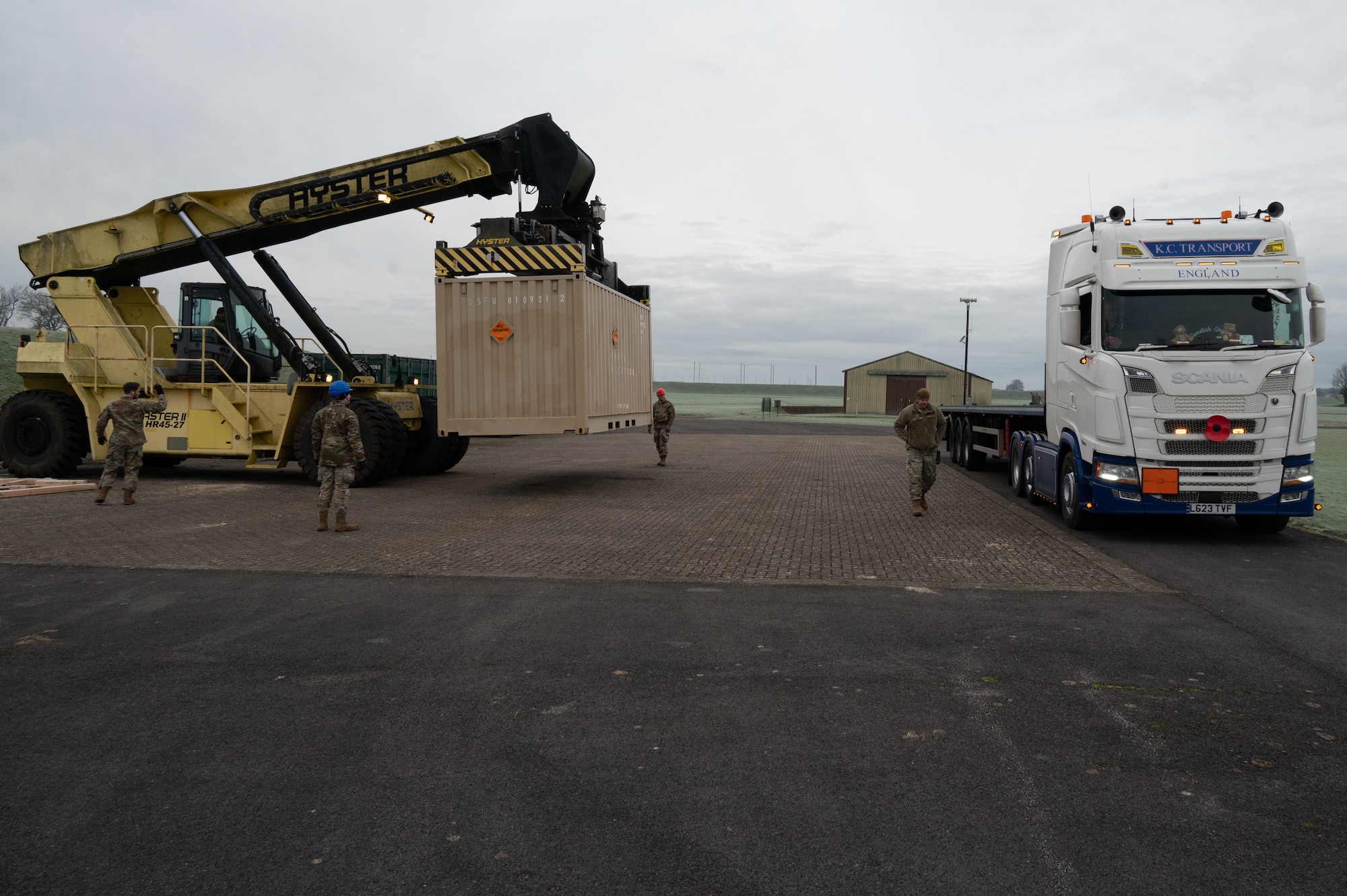 Service members from the 420th Munitions Squadron transfer ammunition