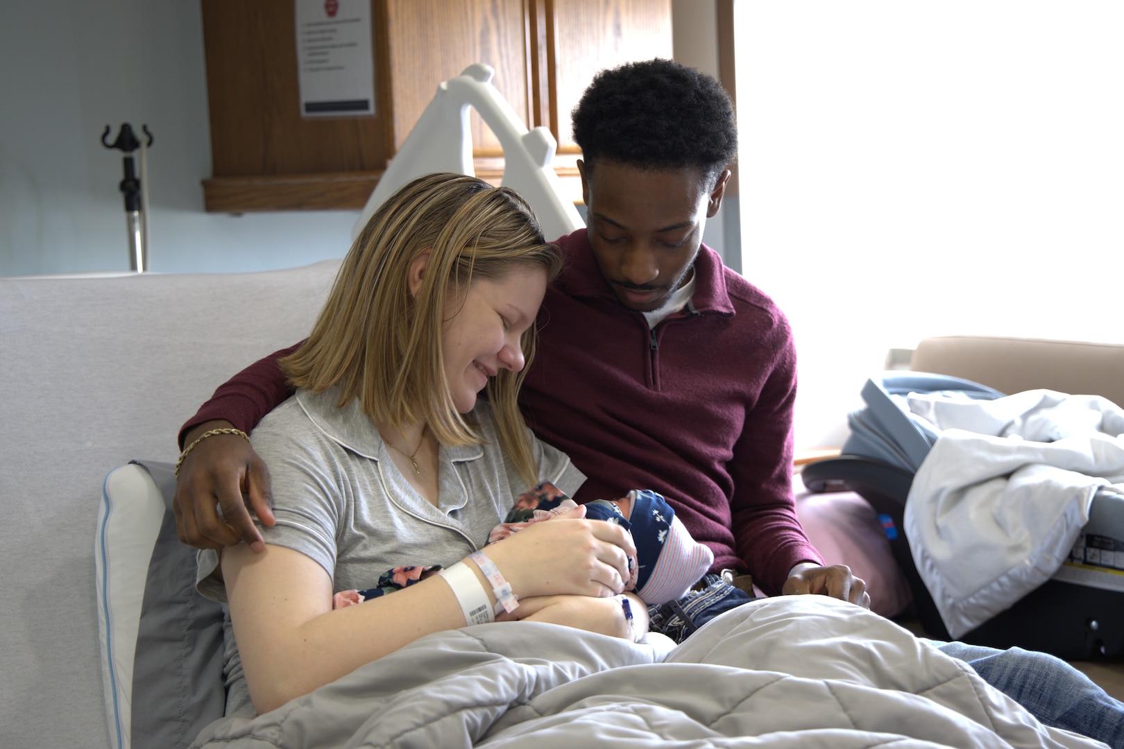 21-year-old Navy Master-at-Arms Seaman Autumn Henigin and her proud husband, 20-year-old Navy Master-at-Arms Seaman Apprentice Latrell Ross, celebrate the birth of their daughter, Sierra Ross, at Walter Reed National Military Medical Center in Bethesda, Maryland. Sierra was the first baby of 2025 to be born at the hospital. (photo courtesy Xavier Myrick)