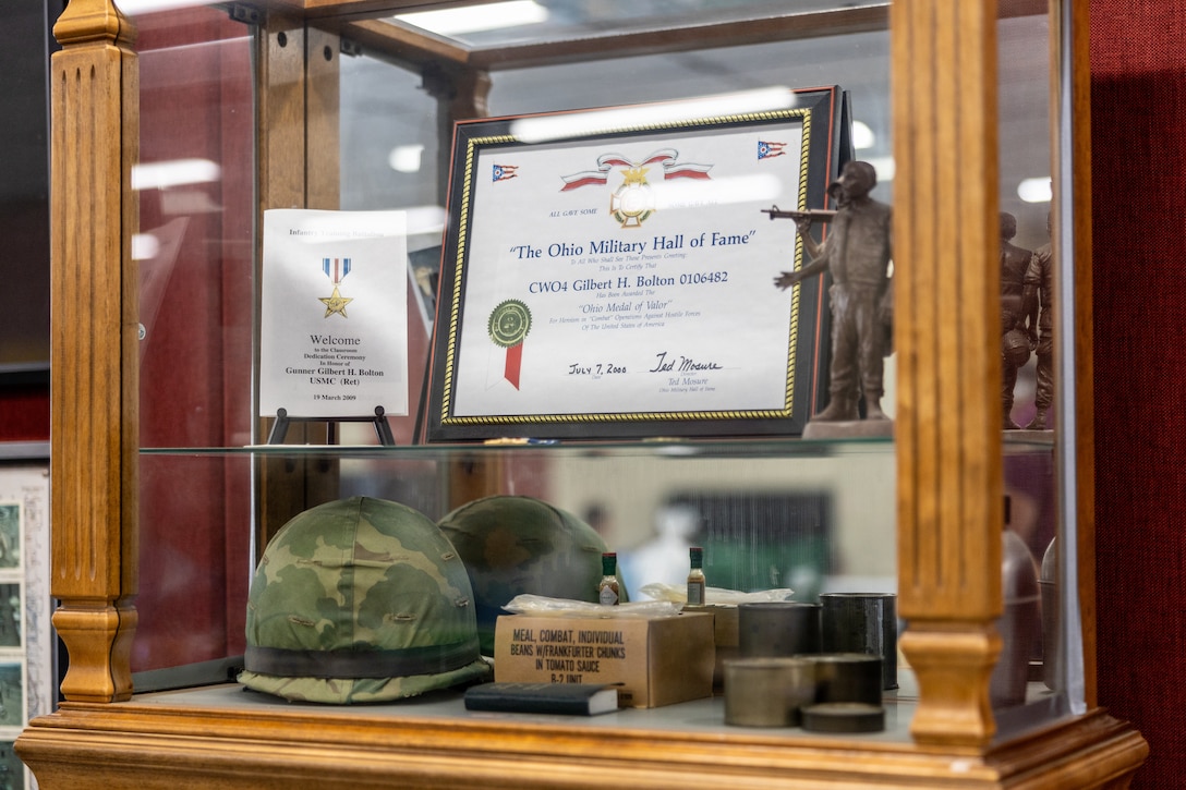 An award shelf for Retired U.S. Marine Corps Chief Warrant Officer 4 Gilbert H. Bolton, a Marine Gunner, is displayed at the School of Infantry-West, Marine Corps Base Camp Pendleton, California, Aug. 22, 2024.  Bolton received a Presidential Lifetime Achievement Award for completing over 4,000 hours of service in his community.  Bolton retired on the first of October in 1991 after 32 years of honorable service. (U.S. Marine Corps photo by Lance Cpl. Mhecaela J. Watts)