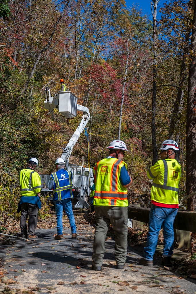Quality assurance personnel with the U.S. Army Corps of Engineers observe contractors performing vegetation removal from roadways at the North Carolina Arboretum, Oct. 22, 2024, in Buncombe County, North Carolina.