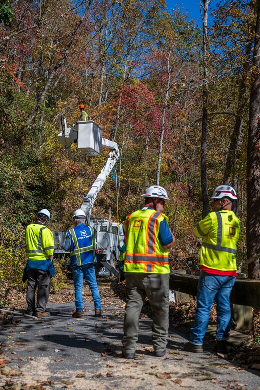 Quality assurance personnel with the U.S. Army Corps of Engineers observe contractors performing vegetation removal from roadways at the North Carolina Arboretum, Oct. 22, 2024, in Buncombe County, North Carolina.