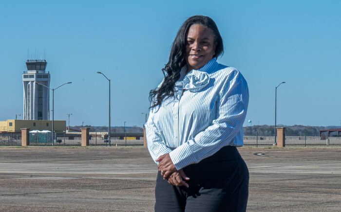 Contina Harmon, 42nd Operations Support Squadron airfield management specialist, poses for a photo on the flight line at Maxwell Air Force Base, Alabama, Jan. 2, 2025.