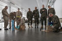 U.S. Marines and recruits with Special Training Company participate in activities during operation happy holiday at MCRD San Diego, California, Dec. 16, 2024. The Mascot’s job is to boost morale, participate in outreach work and attend events and ceremonies.  Marine Corps Community Services, MCRD San Diego, hosted operation happy holiday to spread holiday cheer to recruits and Marines who will be away from family for the holiday season. (U.S. Marine Corps photo by Cpl. Sarah M. Grawcock)
