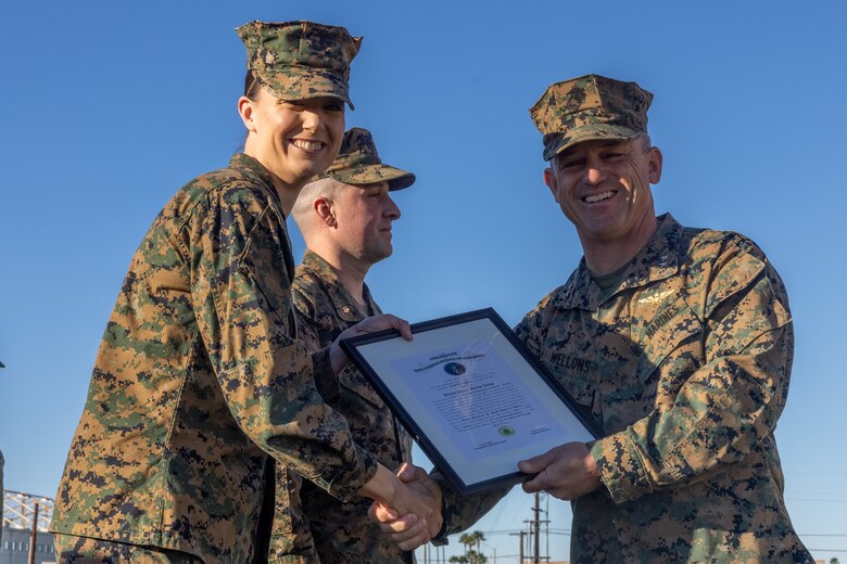 U.S. Marine Corps Maj. Gen. James B. Wellons, right, the commanding general of 3rd Marine Aircraft Wing, and Maj. Leah Deignan, left, an aviation maintenance officer with Aviation Logistics Division, Marine Wing Headquarters Squadron 3, 3rd MAW, pose for a photo  during a promotion ceremony at Marine Corps Air Station Miramar, California, Jan. 6, 2025