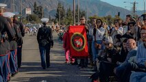 The audience of the 136th Rose Parade watches the U.S. Marine Corps' West Coast Composite Band march in Pasadena, California, Jan. 1, 2025. The Rose Parade, created to showcase the beauty of Pasadena, is part of an annual celebration, Tournament of Roses, that includes various floats, bands, dancers, and equestrian units. The Marine Corps has served the Nation honorably for 250 years. Marines embody the uncompromising standards and characteristics of honor, courage and commitment. (U.S. Marine Corps photo by Cpl. Alexandra M. Earl)
